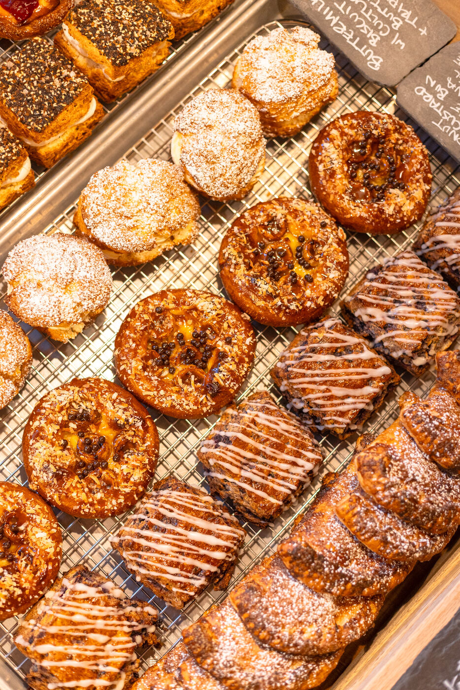 Glazed pastries cooling on a wire rack